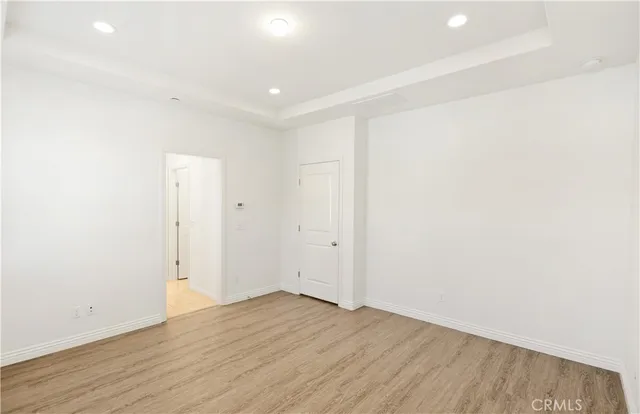 an empty room with wooden floor