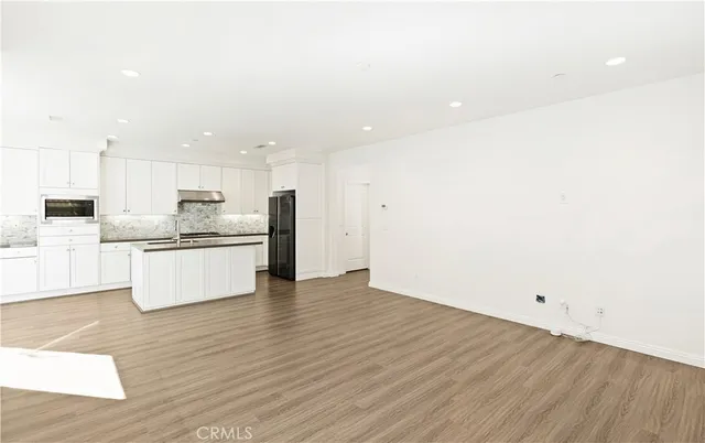 a view of kitchen with wooden floor
