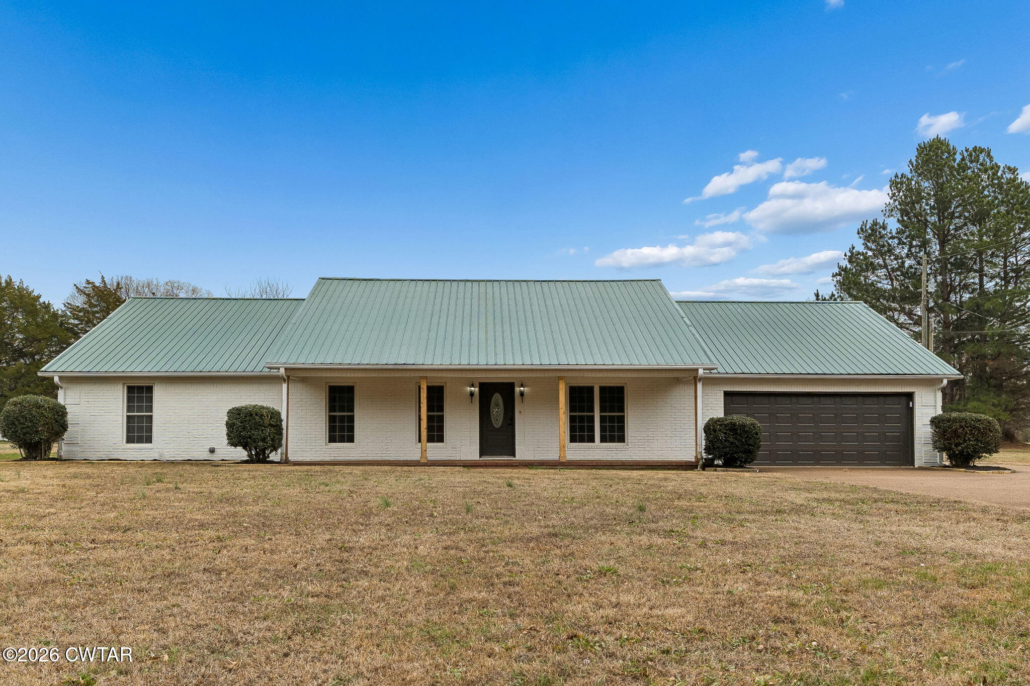 123 Walnut Hill Road Bells, TN 38006 - Photo 2 of 61 a front view of a house with a yard