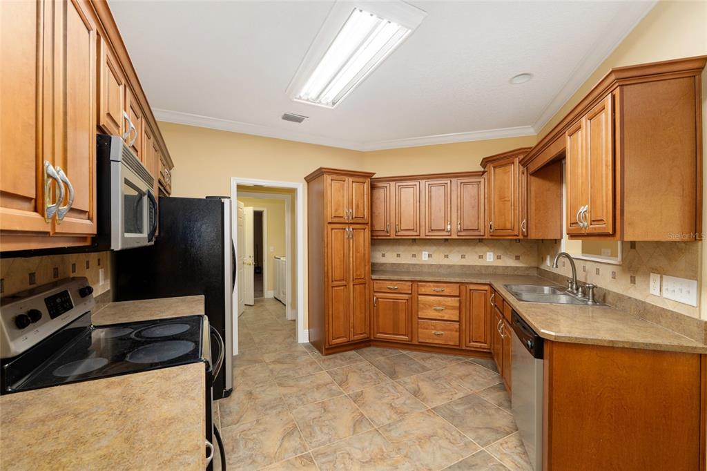191 Slaughter Road Palatka, FL 32177 - Photo 15 of 62 a kitchen with stainless steel appliances granite countertop a refrigerator a sink and dishwasher