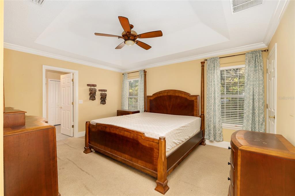 191 Slaughter Road Palatka, FL 32177 - Photo 21 of 62 a bedroom with a bed and wooden floor