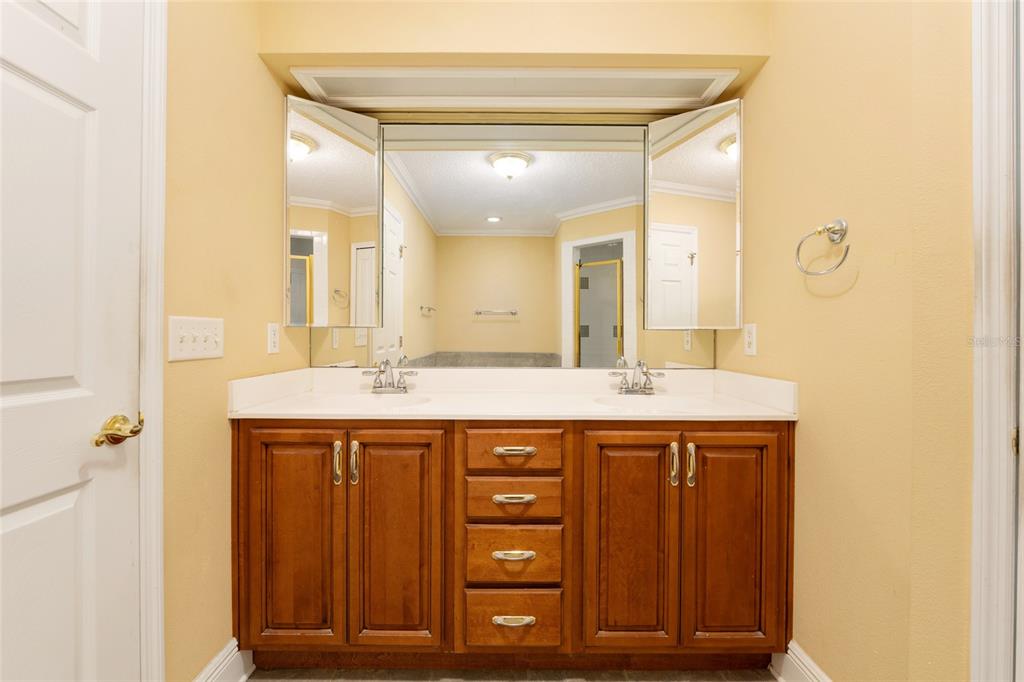 191 Slaughter Road Palatka, FL 32177 - Photo 25 of 62 a bathroom with a granite countertop sink a mirror and a