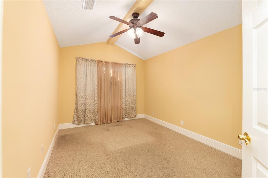 191 Slaughter Road Palatka, FL 32177 - Photo 32 of 62 an empty room with closet and a ceiling fan