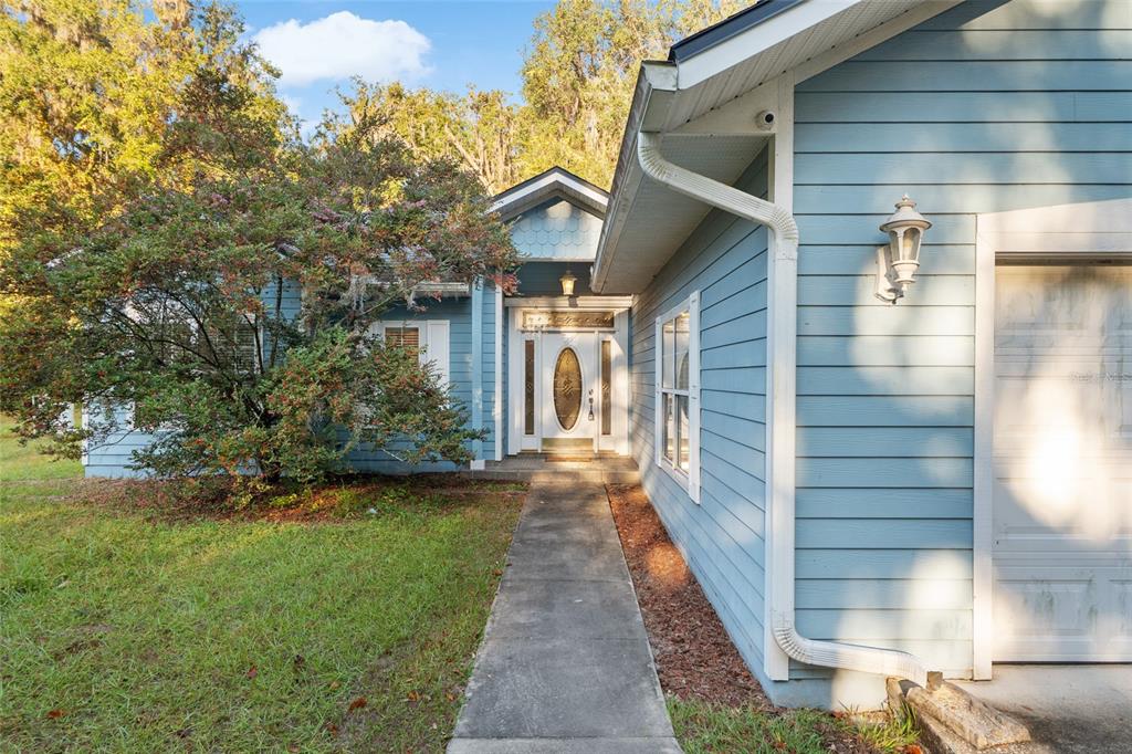 191 Slaughter Road Palatka, FL 32177 - Photo 5 of 62 a view of a pathway of a house with backyard