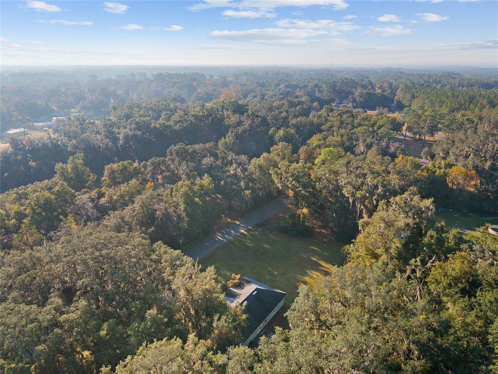 191 Slaughter Road Palatka, FL 32177 - Photo 57 of 62 an aerial view of a house with a yard