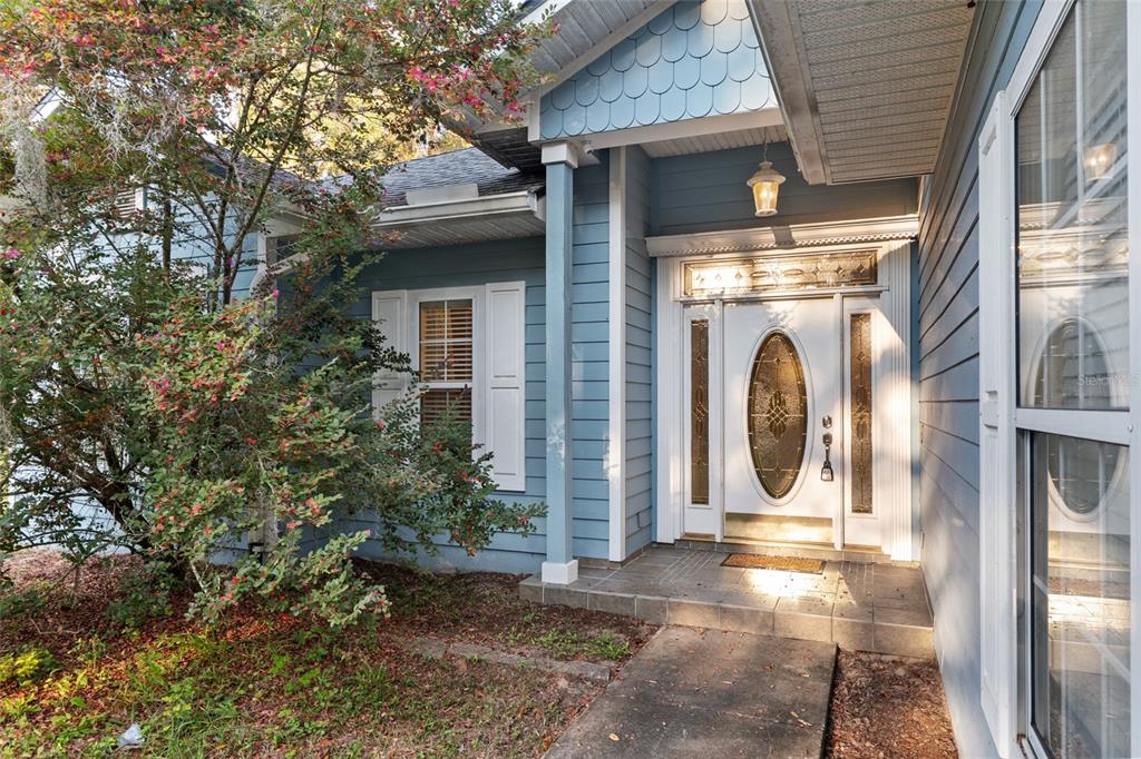 191 Slaughter Road Palatka, FL 32177 - Photo 6 of 62 a view of a house with a door and a tree