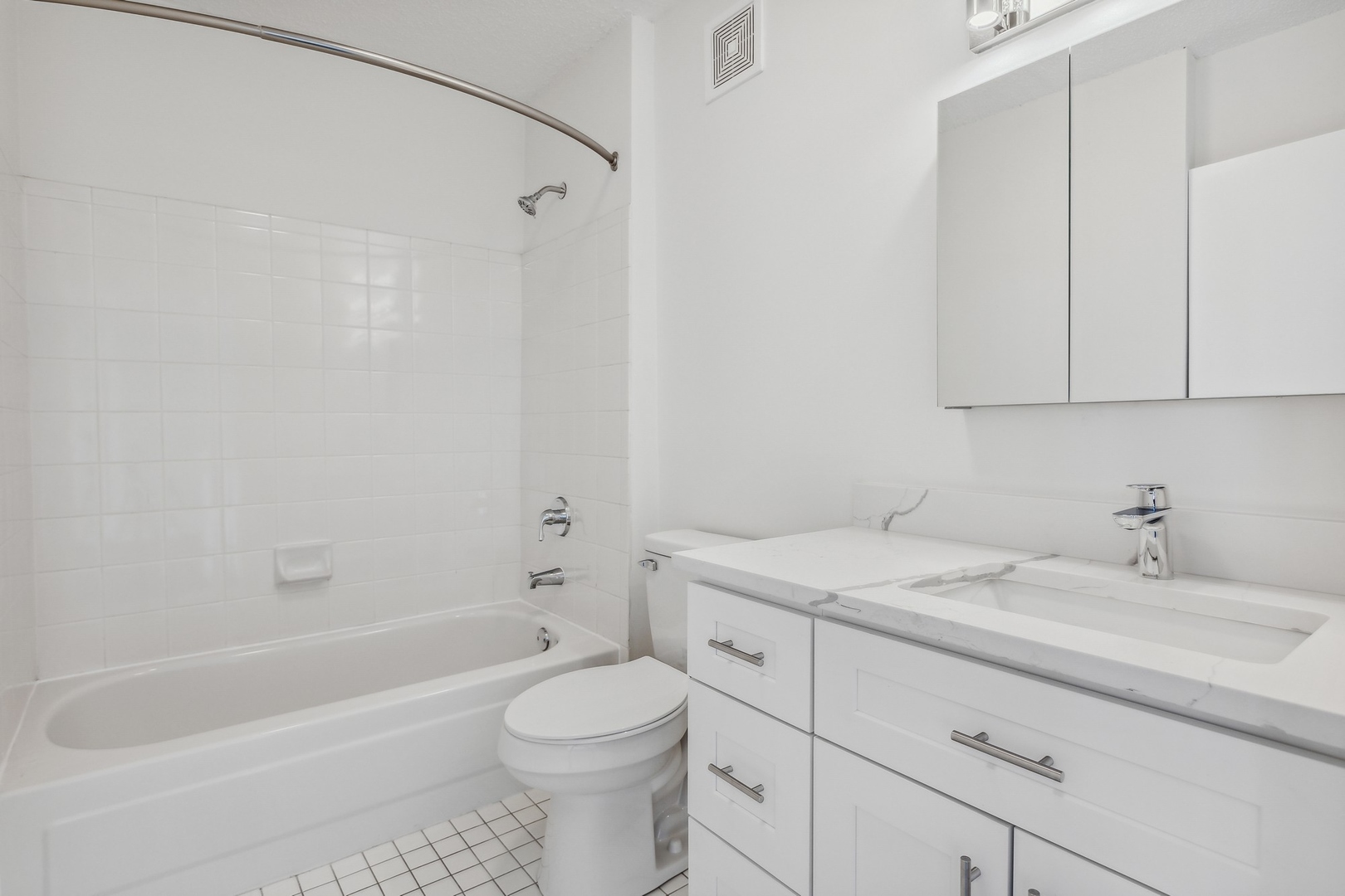 111 West Maple Street, Unit 1208 Chicago, IL 60610 - Photo 11 of 14 a bathroom with a sink a toilet and bathtub