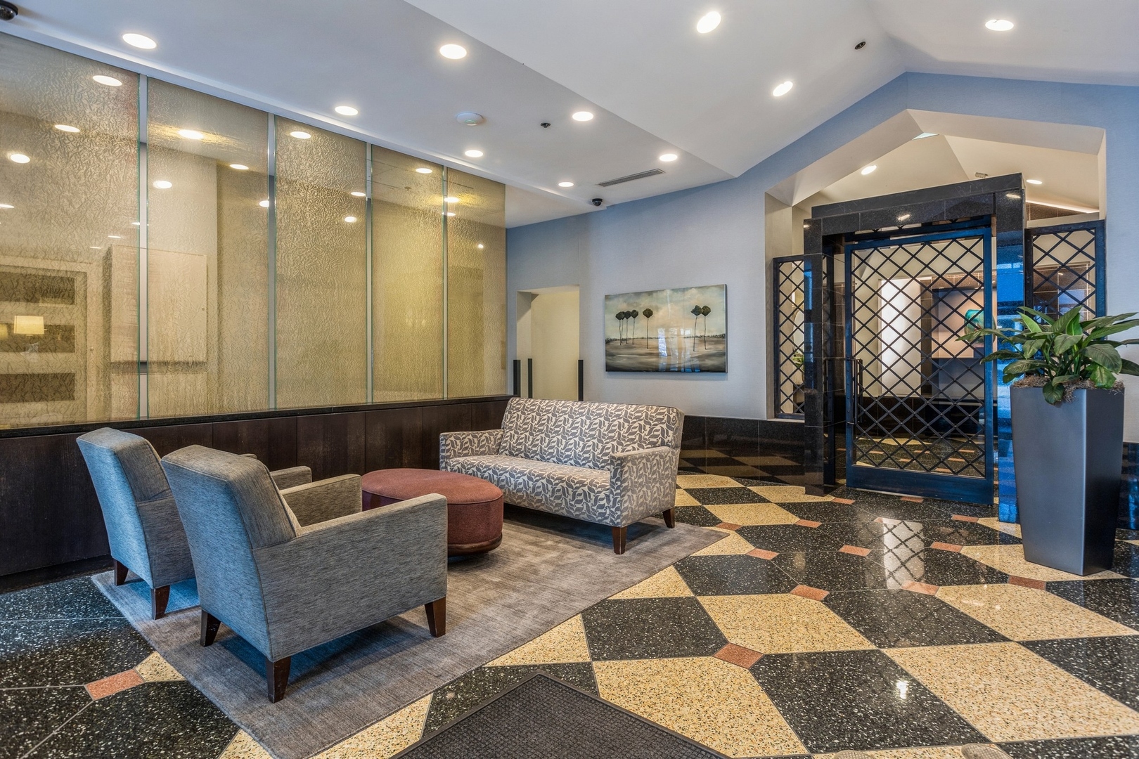 111 West Maple Street, Unit 1208 Chicago, IL 60610 - Photo 12 of 14 a living room with furniture and a rug