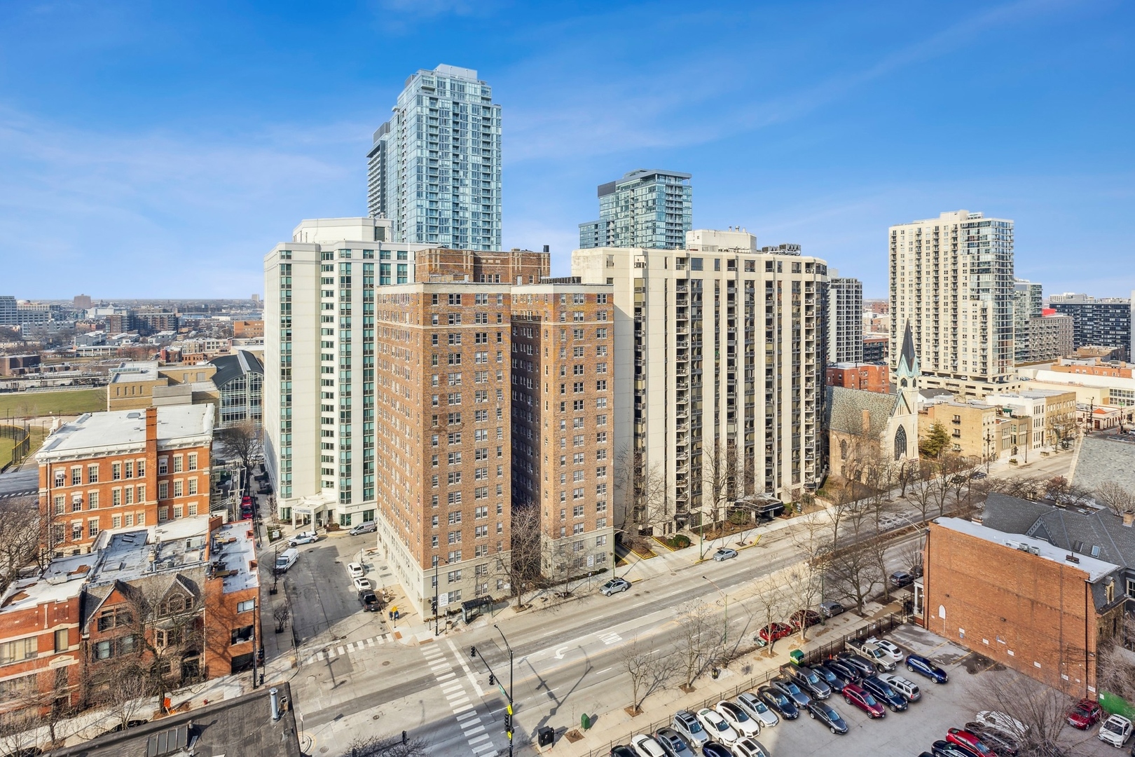 111 West Maple Street, Unit 1208 Chicago, IL 60610 - Photo 8 of 14 a view of a city with tall buildings