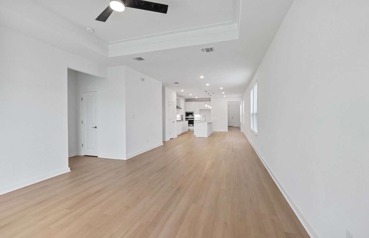 1700 Spg Mountain Cove Georgetown, TX 78628 - Photo 13 of 40 a view of empty room with wooden floor