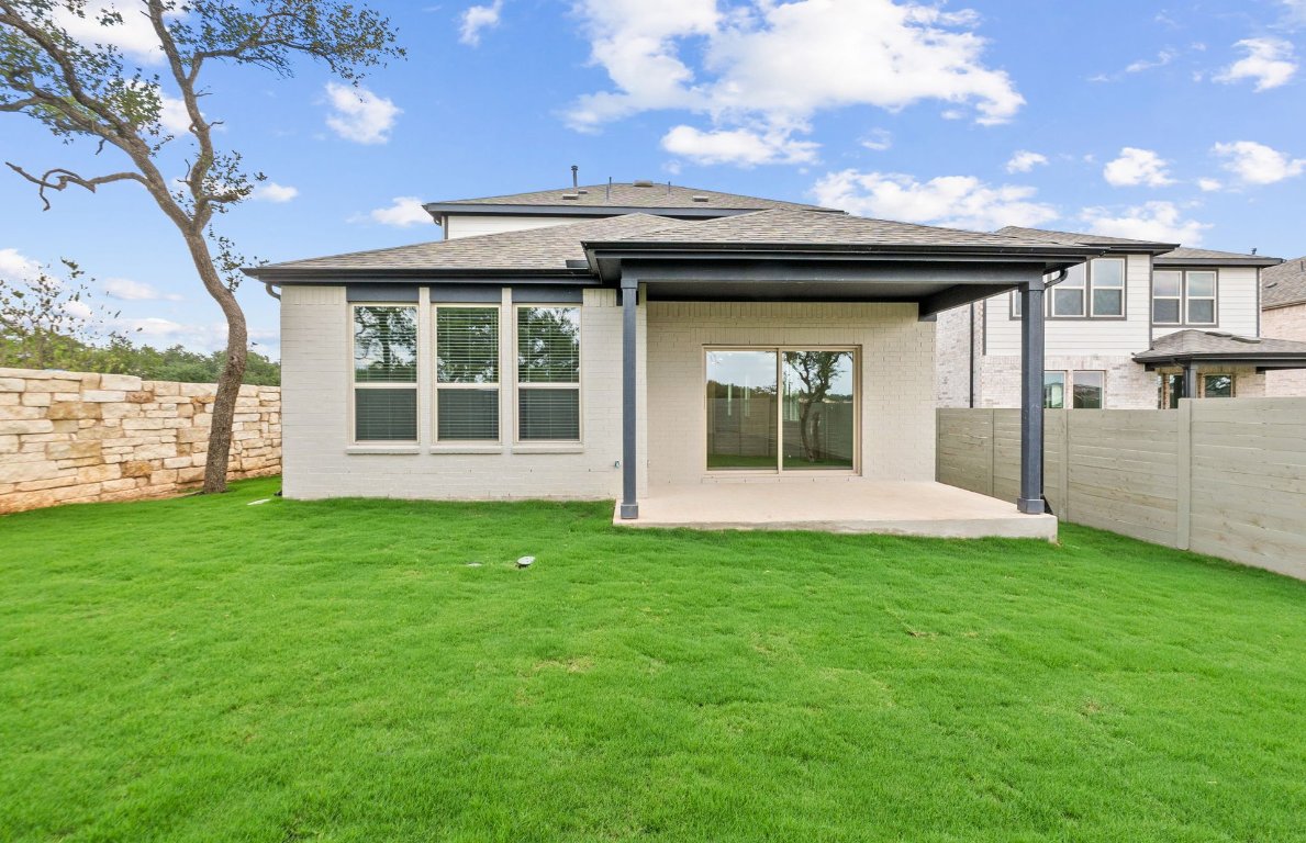 1700 Spg Mountain Cove Georgetown, TX 78628 - Photo 36 of 40 a view of a house with a yard