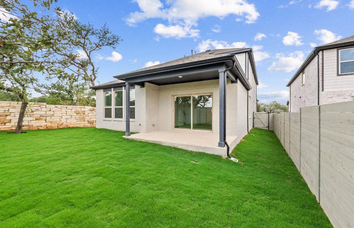 1700 Spg Mountain Cove Georgetown, TX 78628 - Photo 37 of 40 a view of a house with a yard