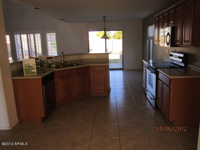 1730 East Harwell Road, Unit 2 Phoenix, AZ 85042 - Photo 8 of 14 KITCHEN WITH TILE FLOORING