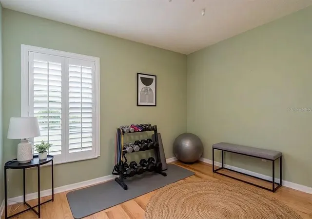 a bedroom with a bed and a chair