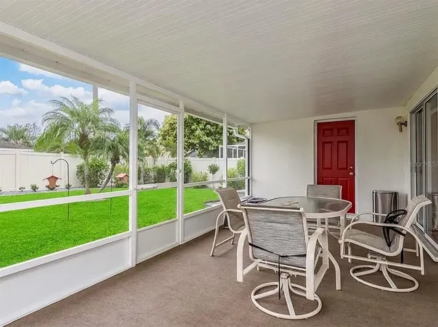 a view of a dining room with furniture window and outside view