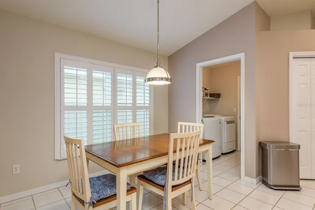 a dining room with furniture and window
