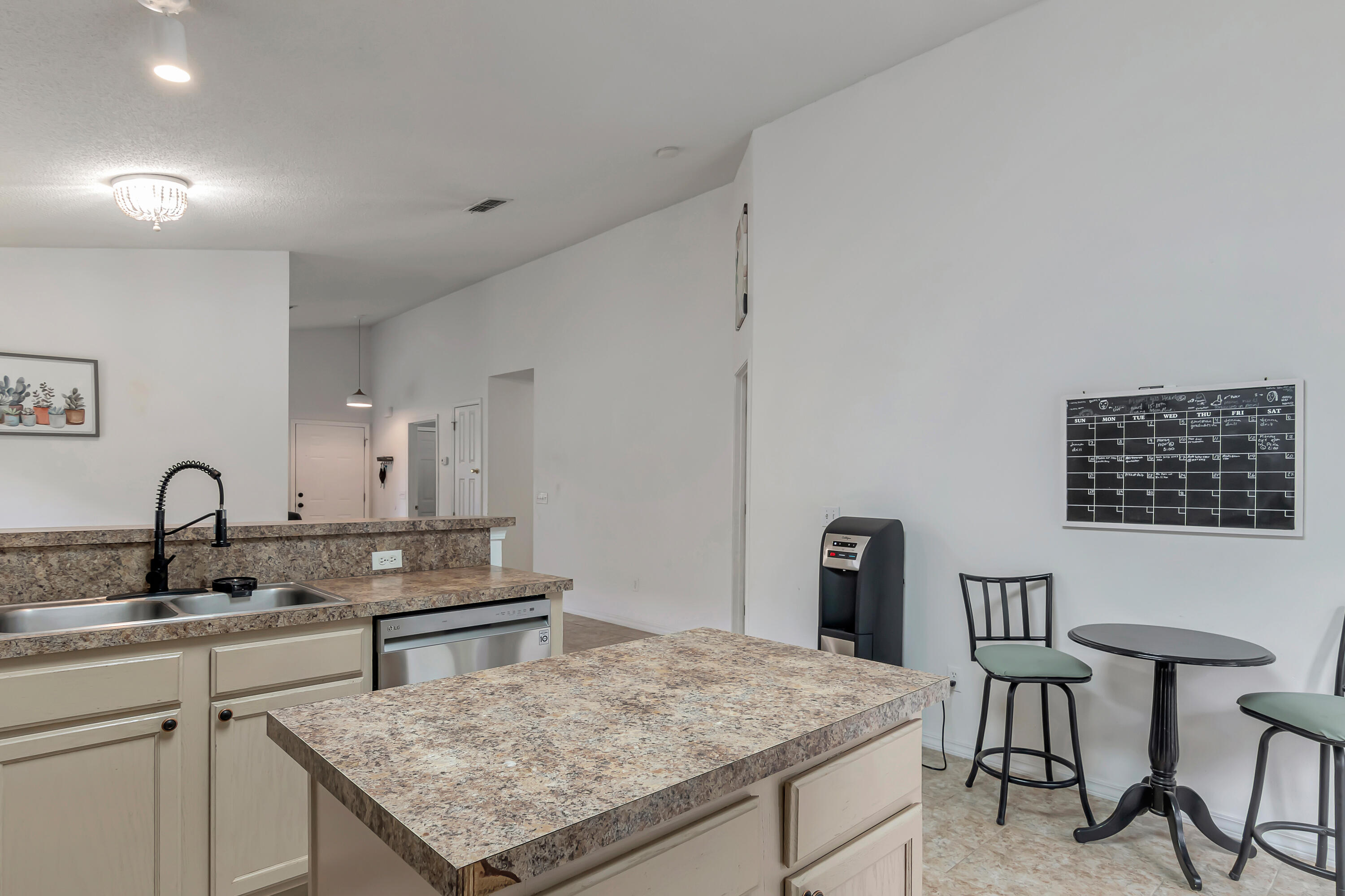 270 Limestone Circle Crestview, FL 32539 - Photo 13 of 35 a kitchen with a stove a sink and a refrigerator