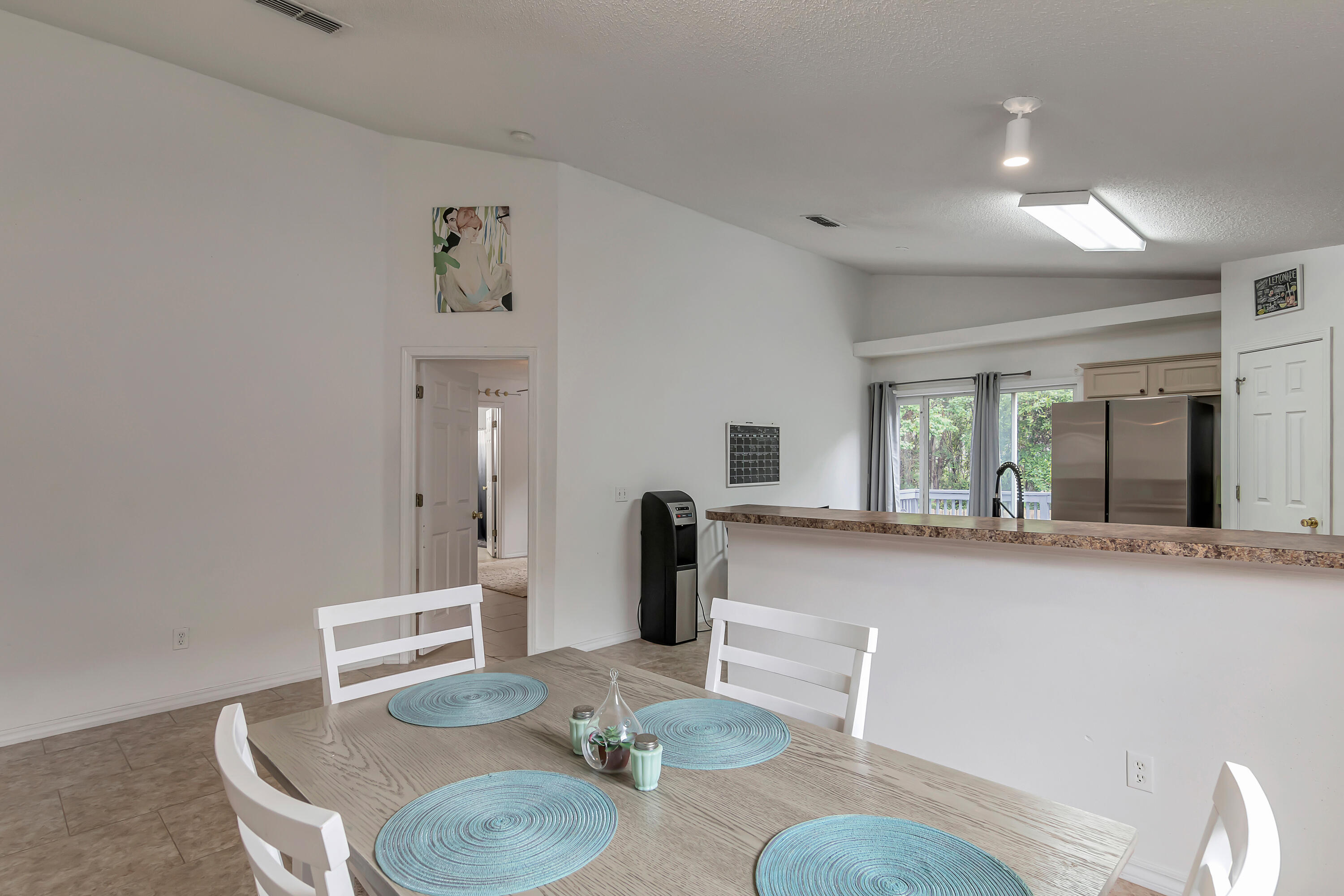 270 Limestone Circle Crestview, FL 32539 - Photo 17 of 35 a dining room with furniture and wooden floor