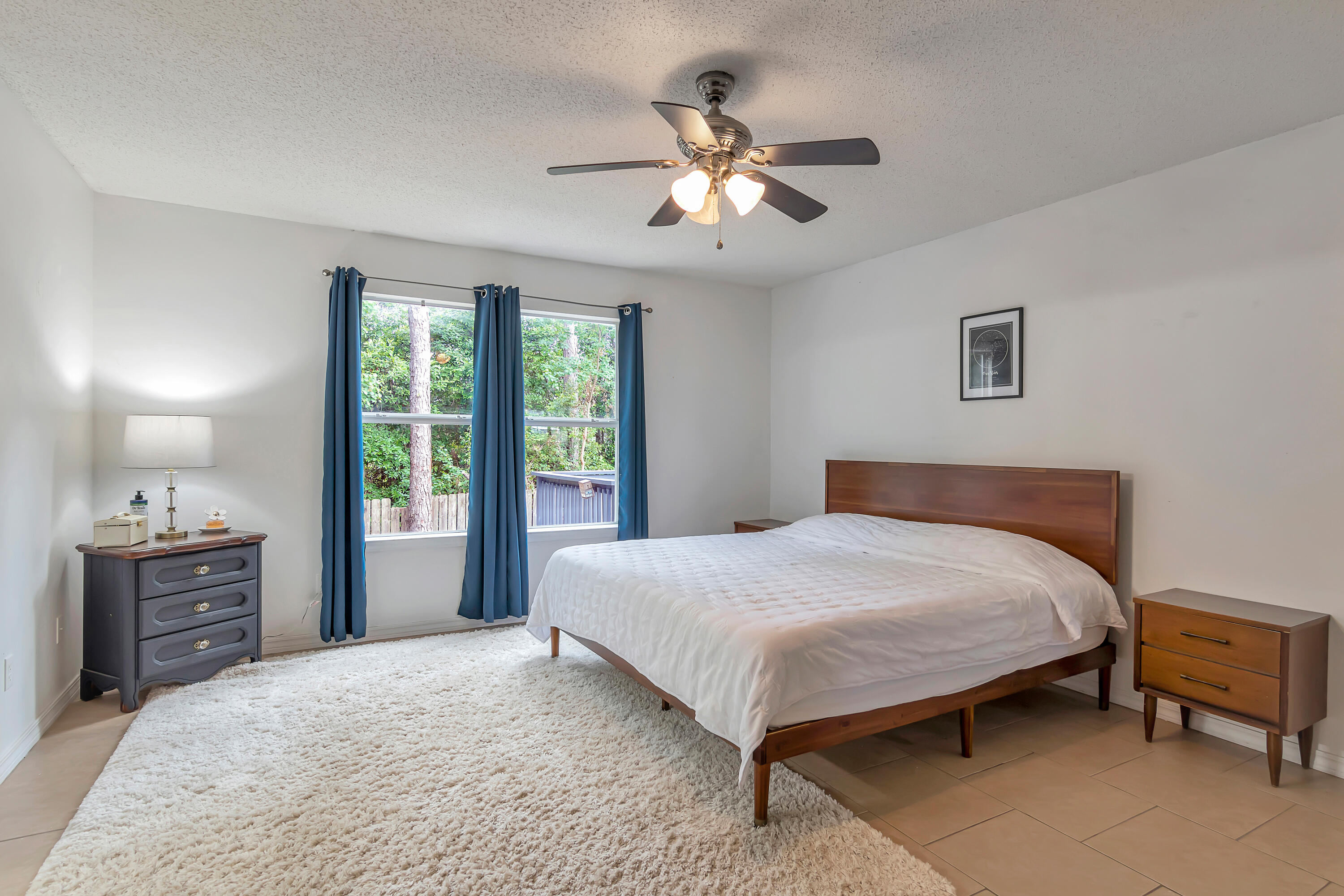 270 Limestone Circle Crestview, FL 32539 - Photo 19 of 35 a bedroom with a bed and a chandelier