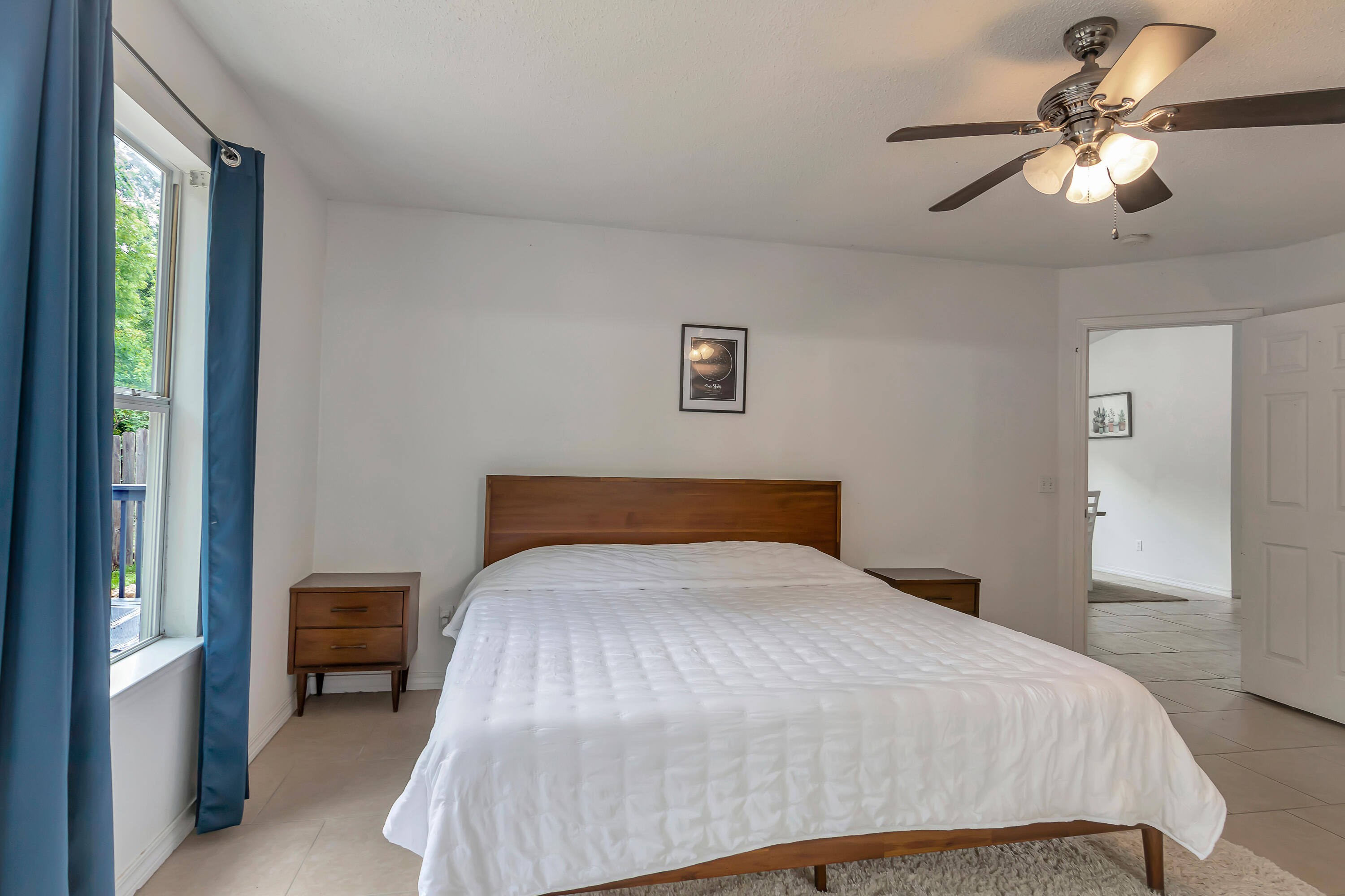270 Limestone Circle Crestview, FL 32539 - Photo 20 of 35 a bedroom with a large bed and a chandelier