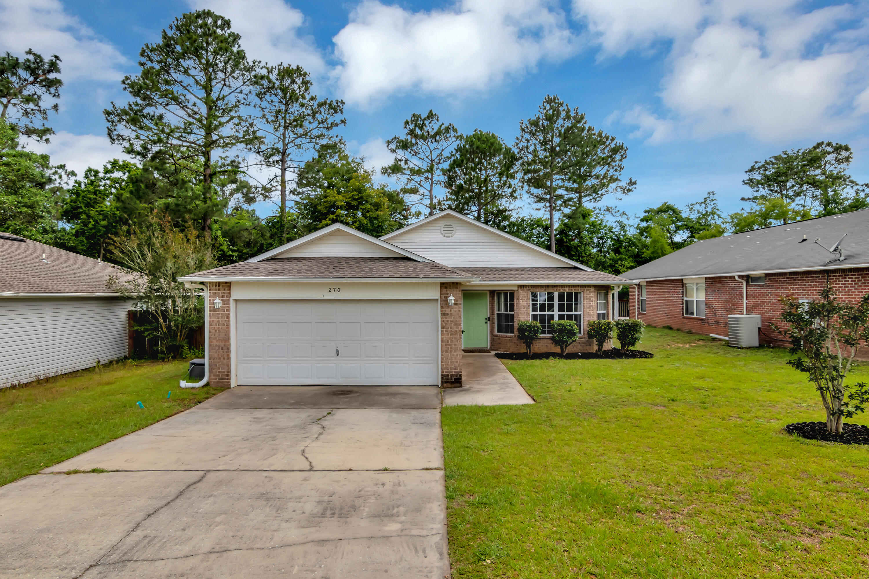 270 Limestone Circle Crestview, FL 32539 - Photo 2 of 35 a front view of a house with garden