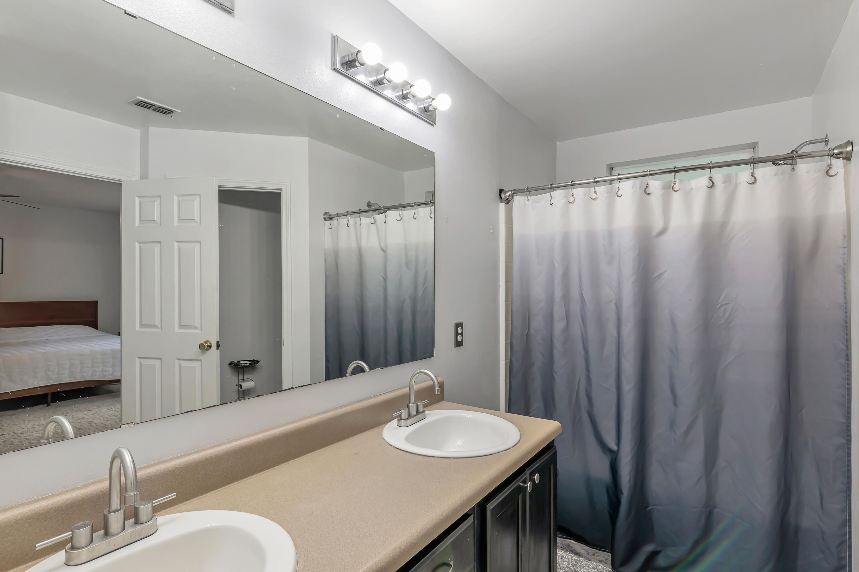 270 Limestone Circle Crestview, FL 32539 - Photo 22 of 35 a bathroom with a sink and a mirror