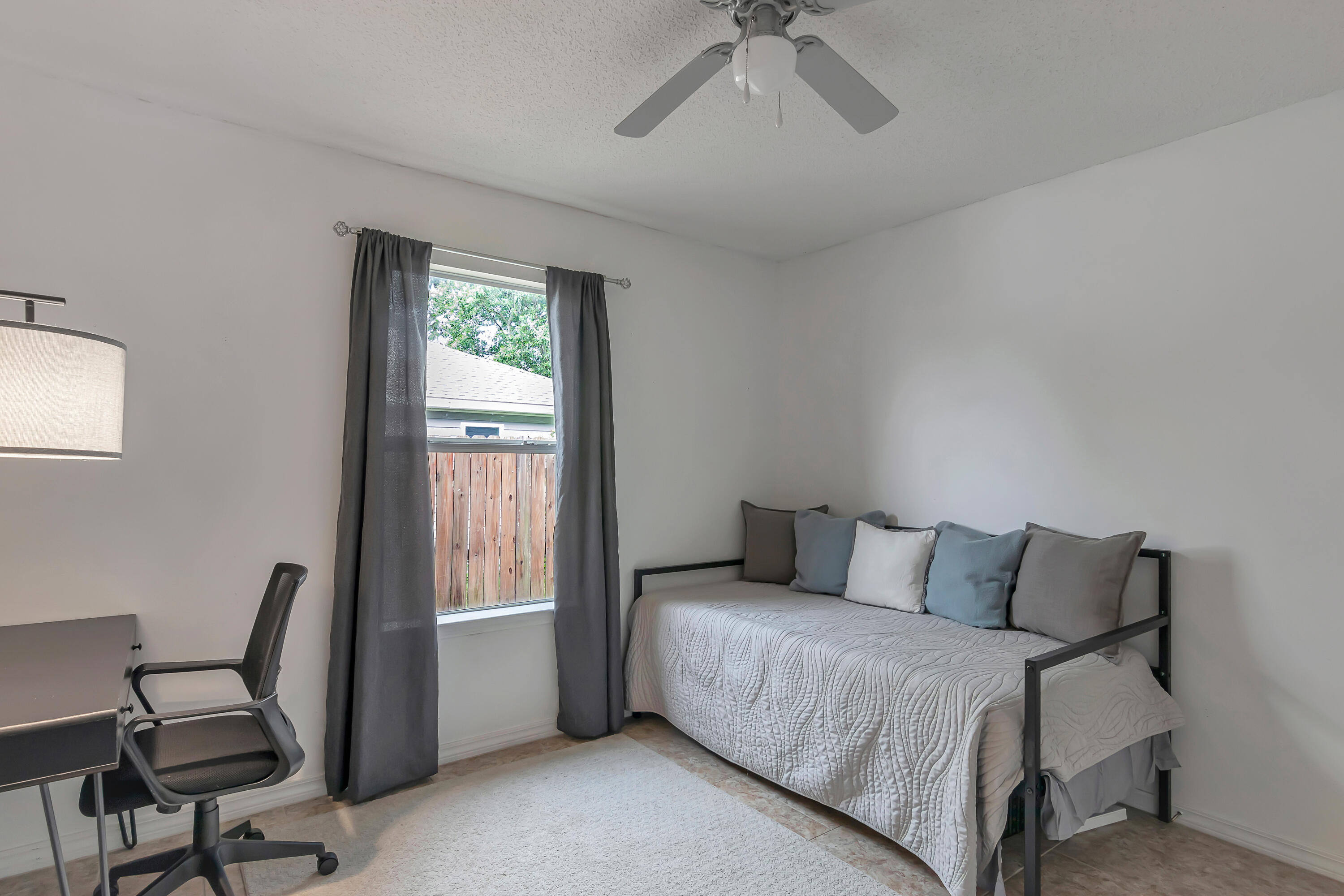 270 Limestone Circle Crestview, FL 32539 - Photo 24 of 35 a bedroom with a bed and a window