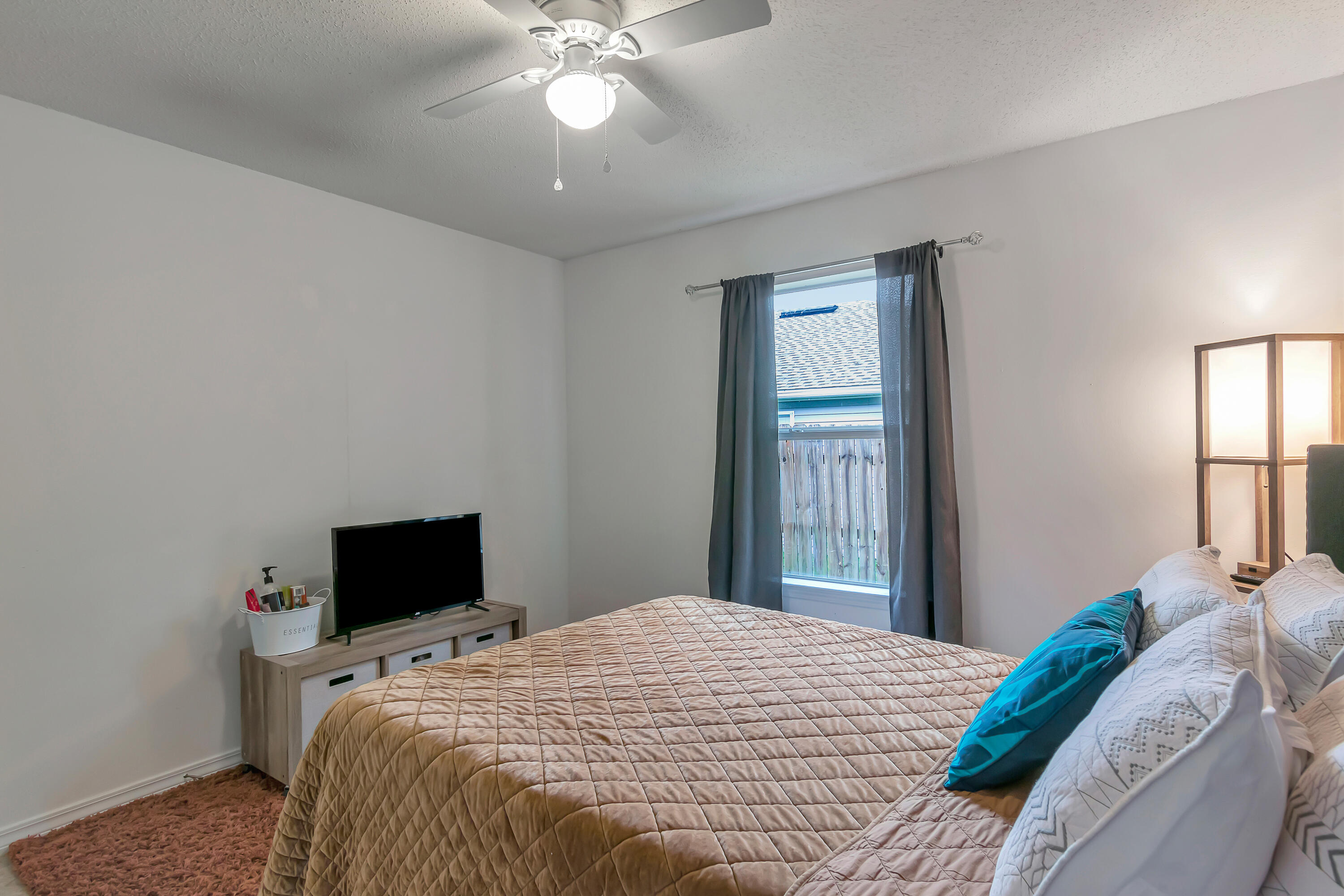 270 Limestone Circle Crestview, FL 32539 - Photo 27 of 35 a bedroom with a bed and a window