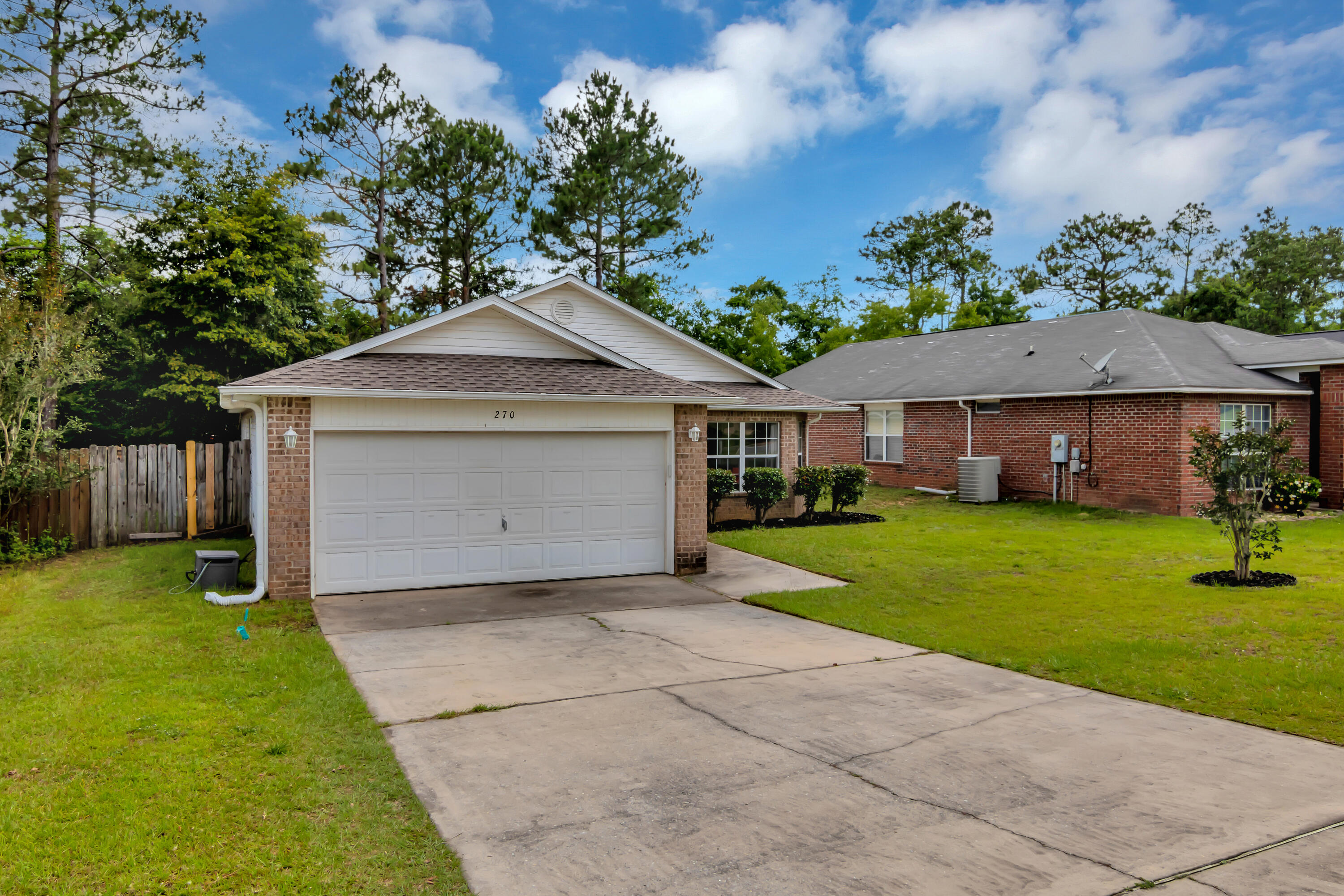 270 Limestone Circle Crestview, FL 32539 - Photo 3 of 35 a front view of a house with a yard and garage