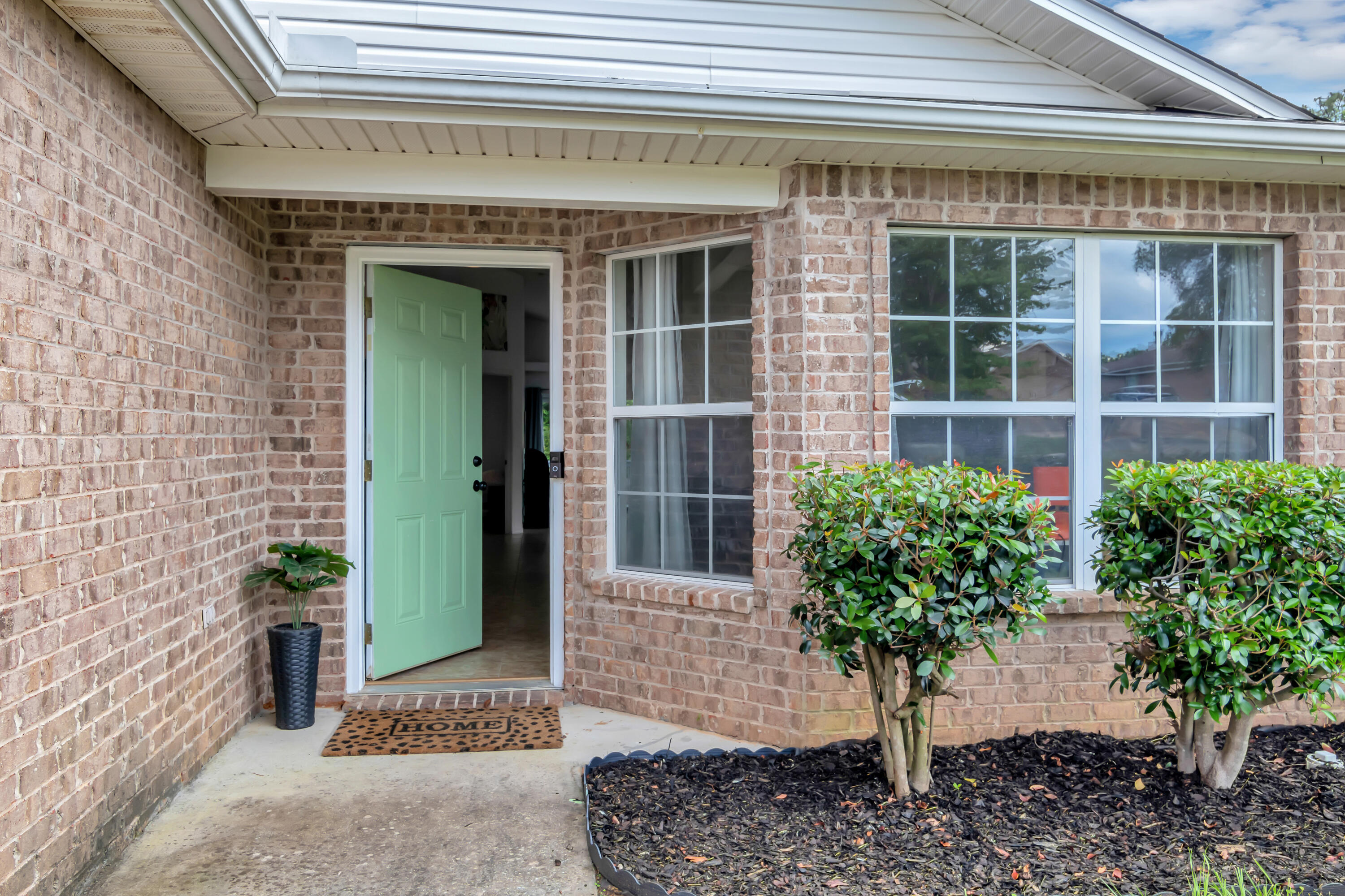 270 Limestone Circle Crestview, FL 32539 - Photo 5 of 35 a front view of a house with a plants
