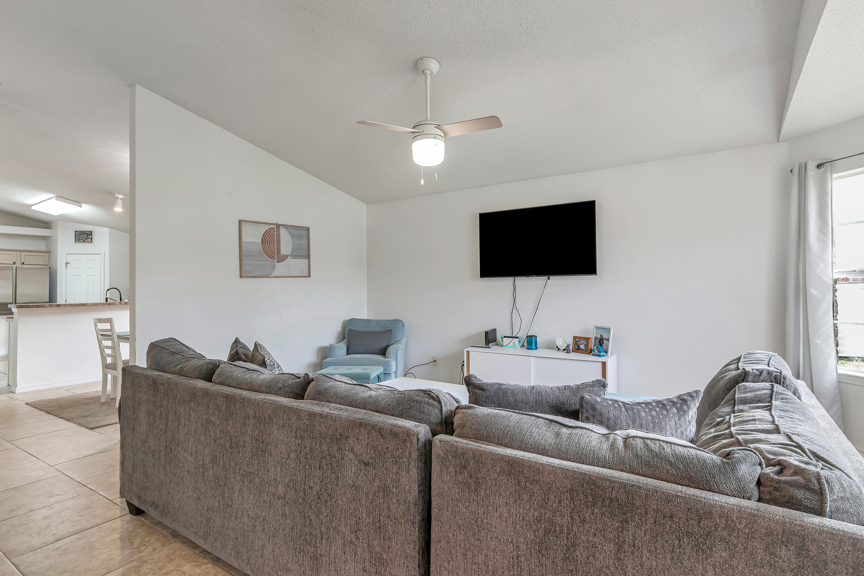 270 Limestone Circle Crestview, FL 32539 - Photo 6 of 35 a living room with furniture and a flat screen tv