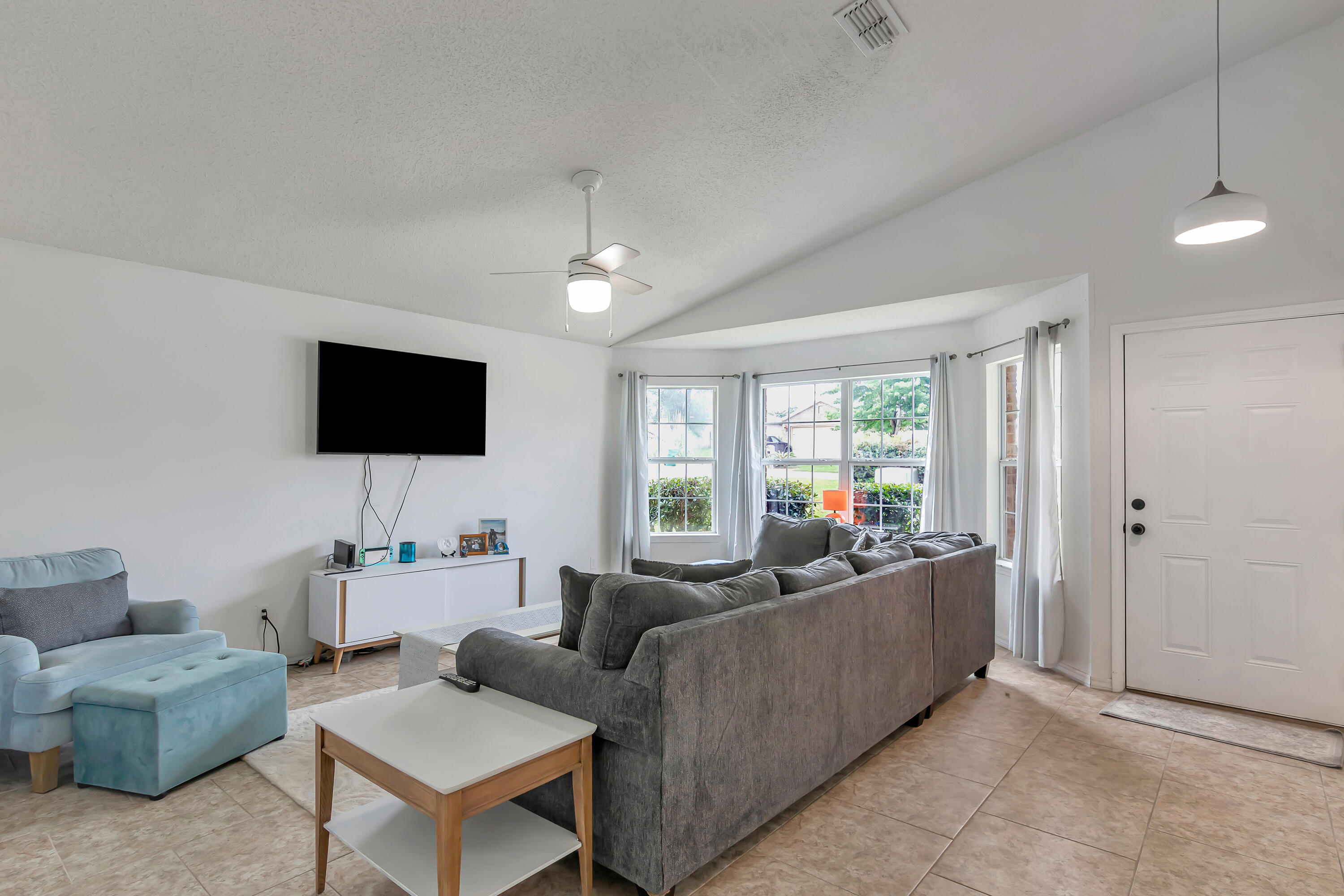 270 Limestone Circle Crestview, FL 32539 - Photo 7 of 35 a living room with furniture and a flat screen tv