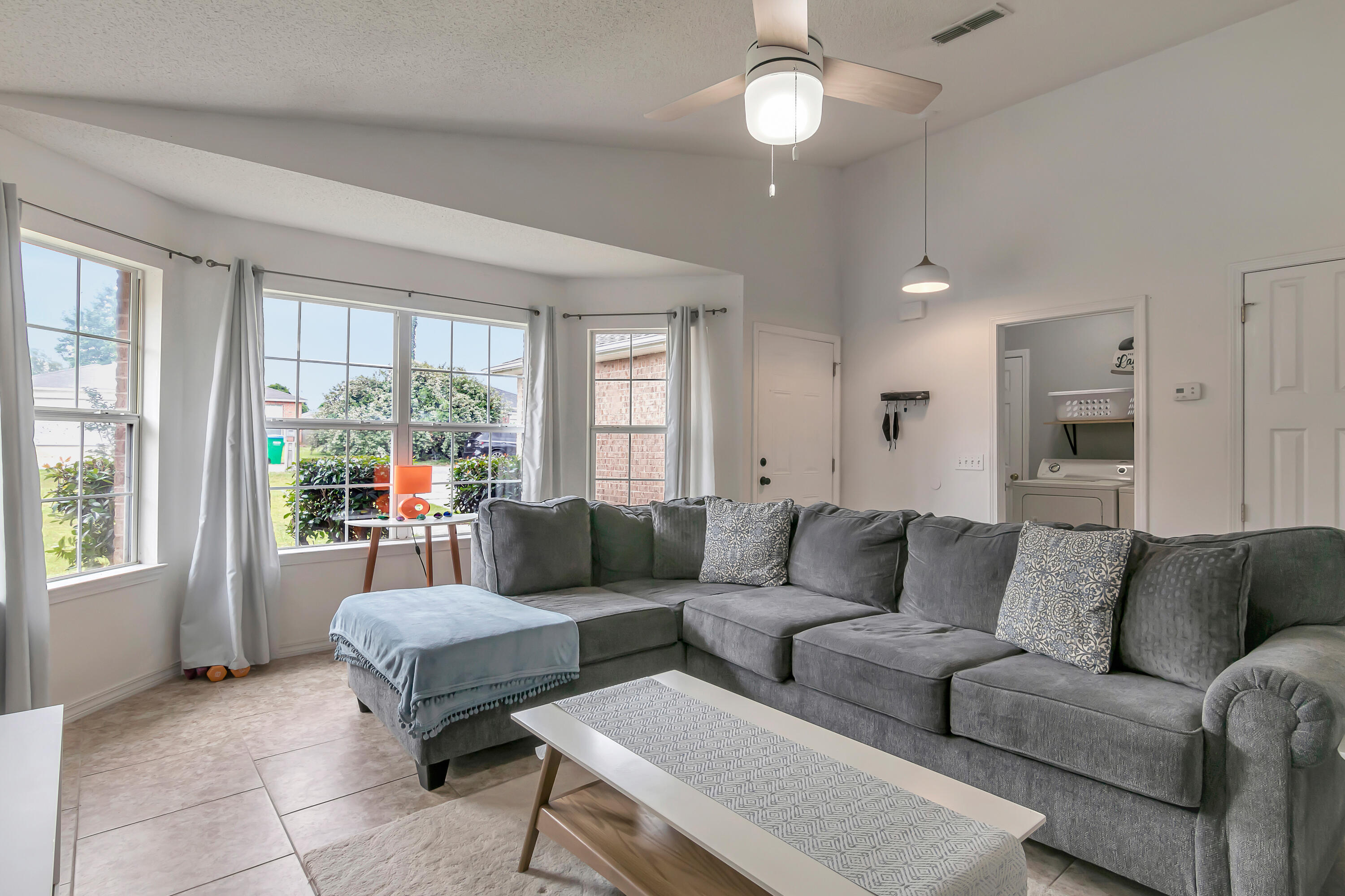 270 Limestone Circle Crestview, FL 32539 - Photo 8 of 35 a living room with furniture and a large window