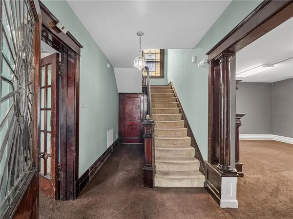 a view of a hallway with staircase