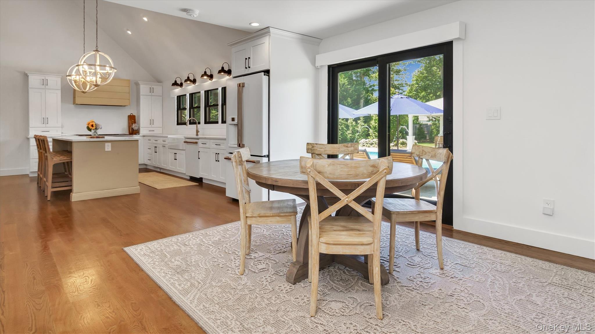 99 Beach Road Westhampton Beach, NY 11978 - Photo 15 of 37 a view of a dining room with furniture and a large window