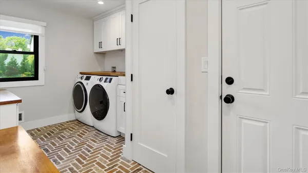 a utility room with dryer and washer