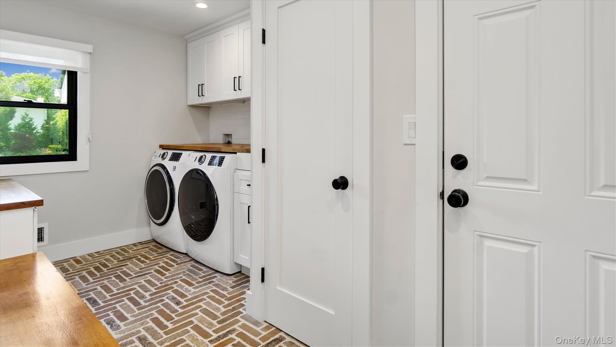 99 Beach Road Westhampton Beach, NY 11978 - Photo 19 of 37 a utility room with dryer and washer