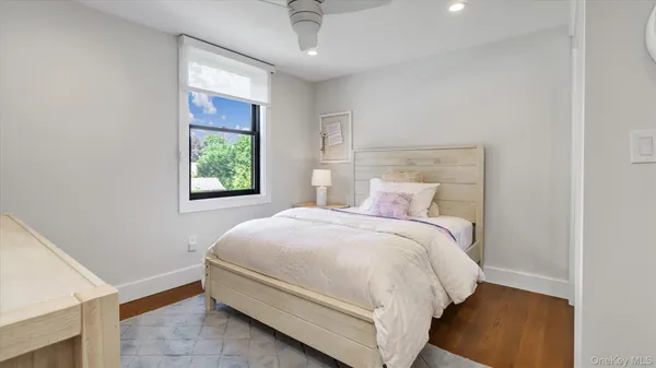 a bed room with a bed and a window