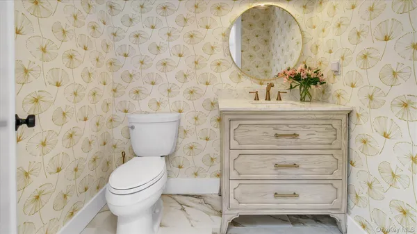 a bathroom with a toilet and a sink