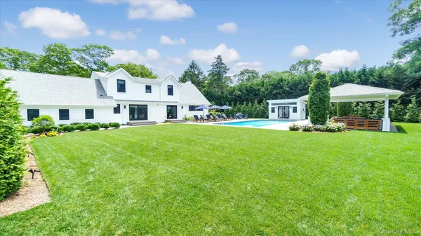 an aerial view of a house with a yard