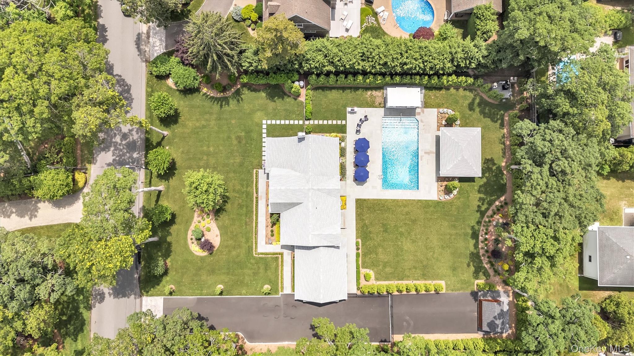 99 Beach Road Westhampton Beach, NY 11978 - Photo 37 of 37 an aerial view of a house with a yard
