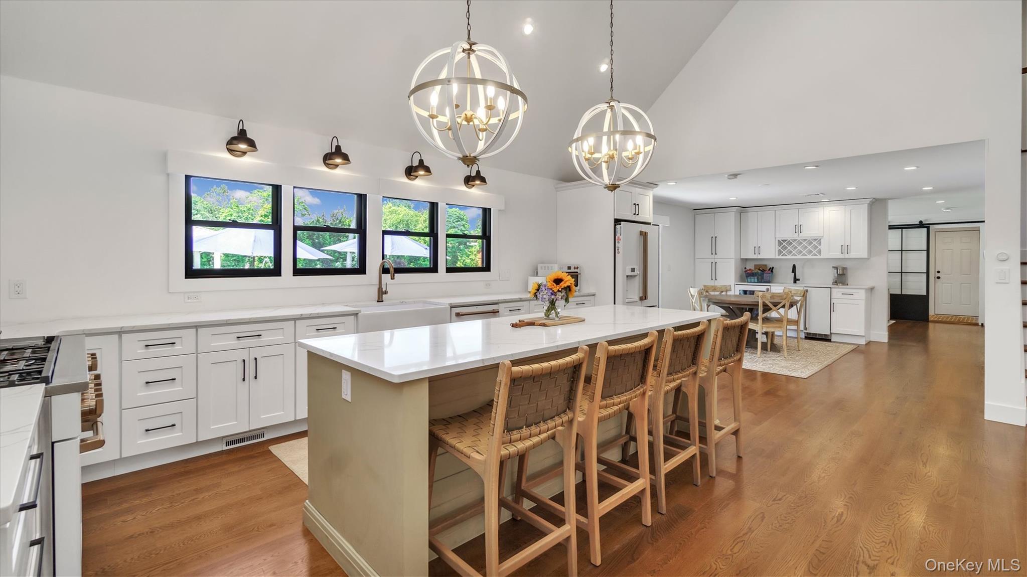 99 Beach Road Westhampton Beach, NY 11978 - Photo 7 of 37 a large kitchen with a table and chairs