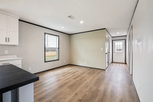 a view of kitchen and wooden floor