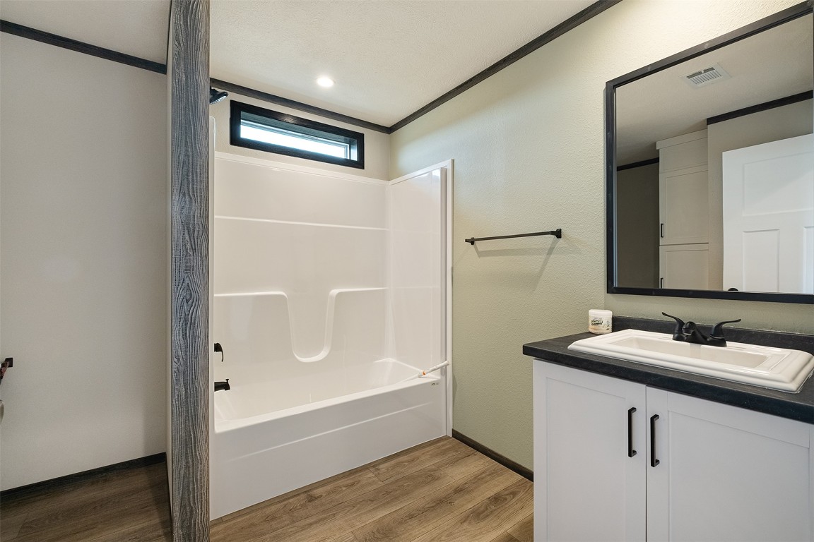 339 Lower Red Rock Road Bastrop, TX 78602 - Photo 18 of 29 a bathroom with a bathtub and a sink