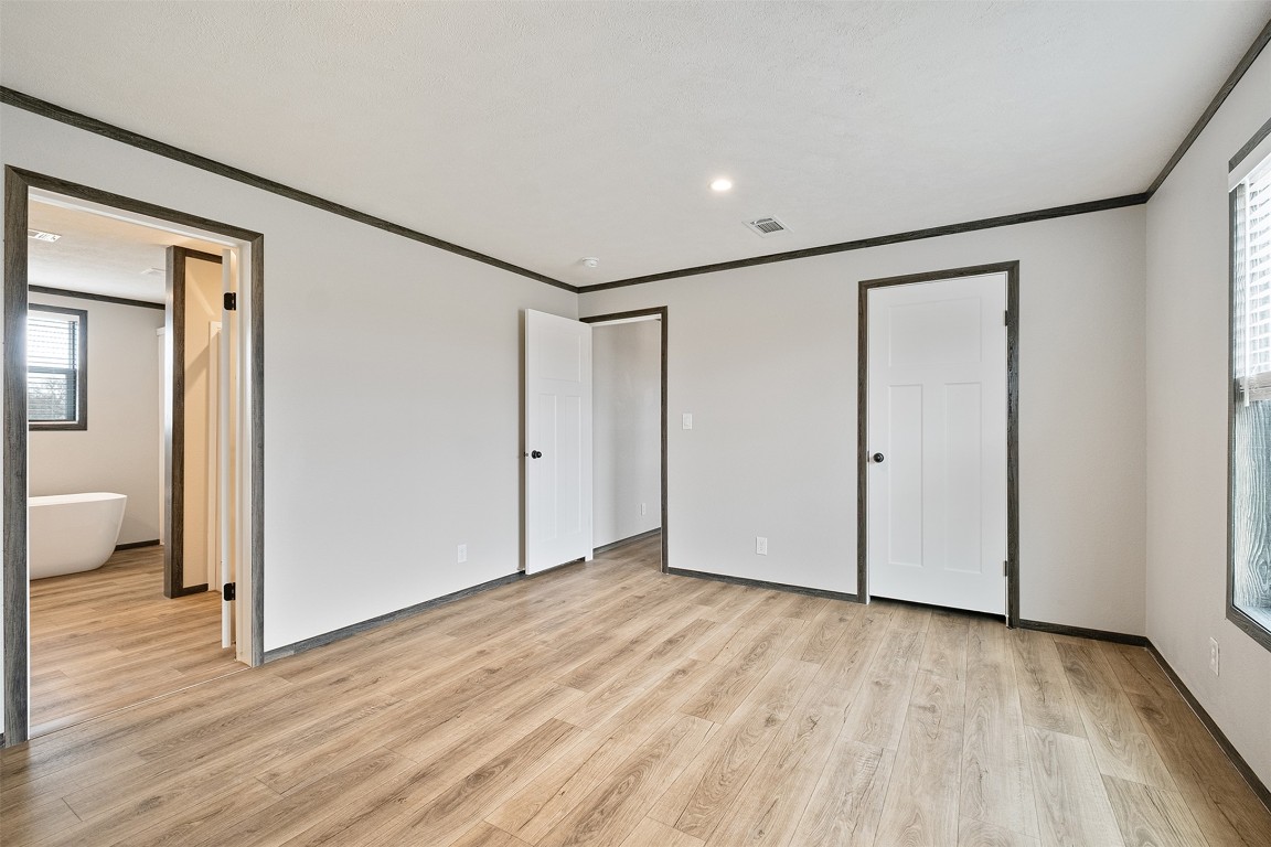 339 Lower Red Rock Road Bastrop, TX 78602 - Photo 20 of 29 a view of empty room with wooden floor