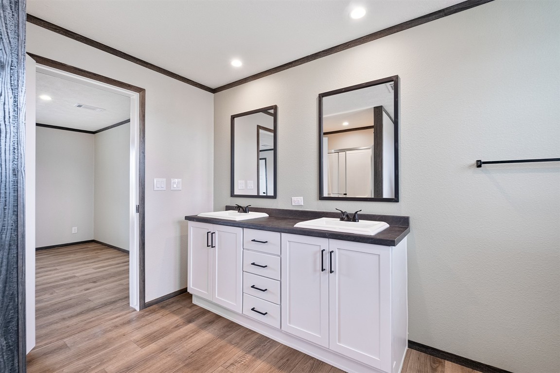 339 Lower Red Rock Road Bastrop, TX 78602 - Photo 22 of 29 a bathroom with a granite countertop sink vanity mirror and a