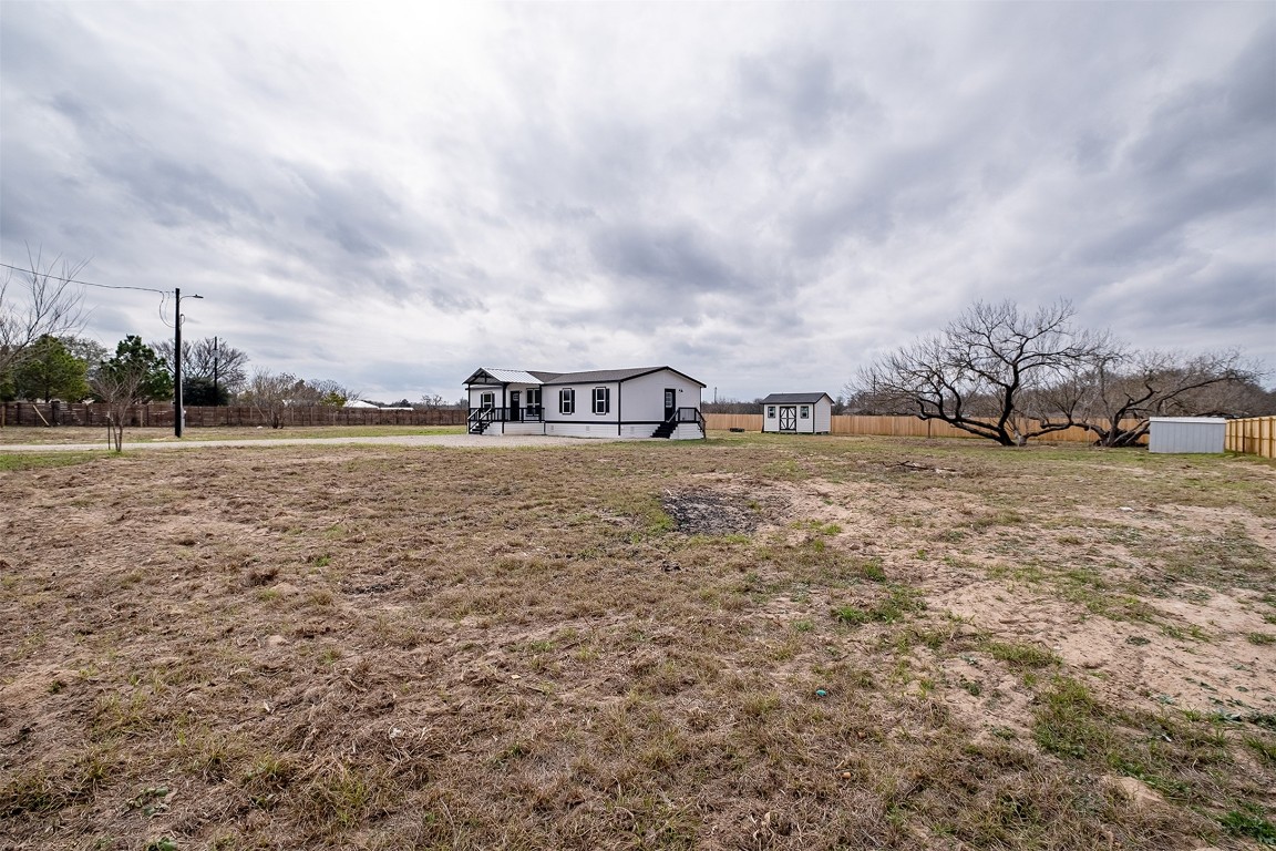 339 Lower Red Rock Road Bastrop, TX 78602 - Photo 26 of 29 a view of a lake with houses in the back