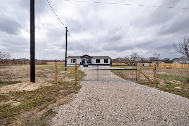 a view of a lake with houses in the back