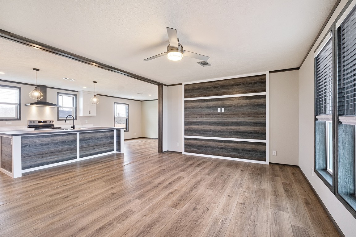 339 Lower Red Rock Road Bastrop, TX 78602 - Photo 6 of 29 a view of kitchen with wooden floor electronic appliances and window