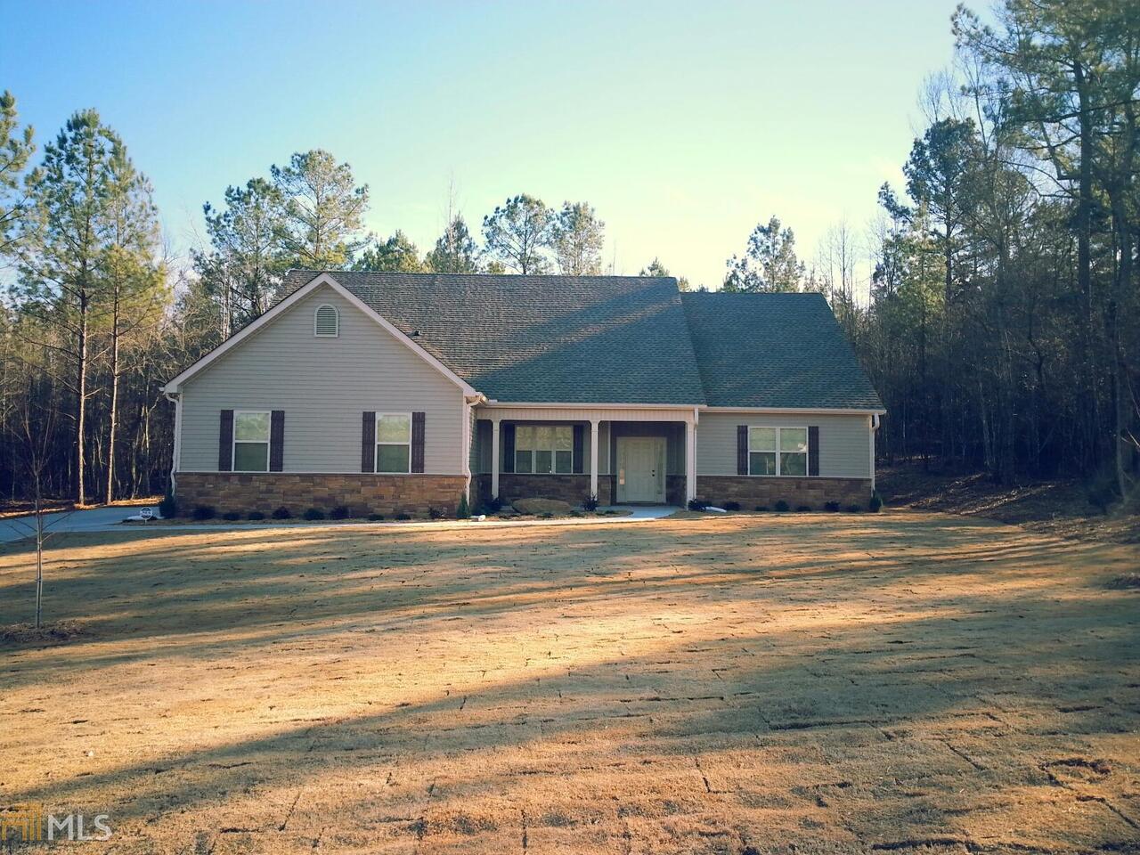84 Ridgeview Drive, Unit 58 Newnan, GA 30263 - Photo 1 of 1 a view of a house with a yard